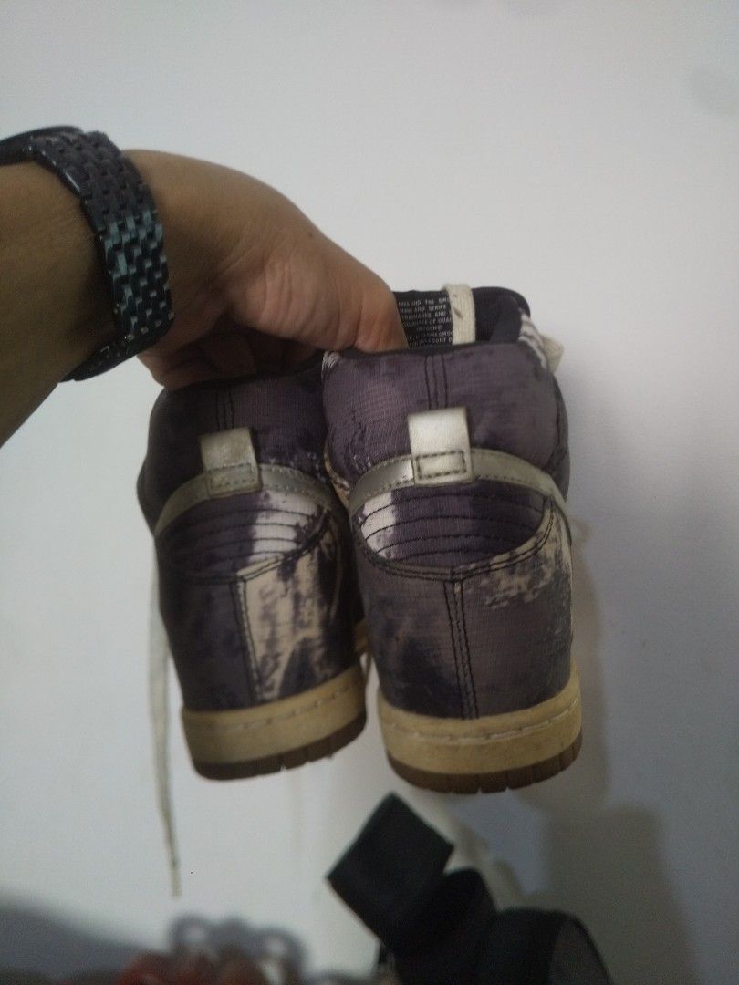 Nike Dunk High Wedge Sneakers (Category: Sneakers) located in Binan City. Submitted by rpute (Listing ID 1461558349, Image 3). Description: - Nike Dunk High wedge sneakers - Unique grey and white tie-dye/marbled pattern - Silver Nike Swoosh detail - White laces - Light tan soles - Adds height and style.
