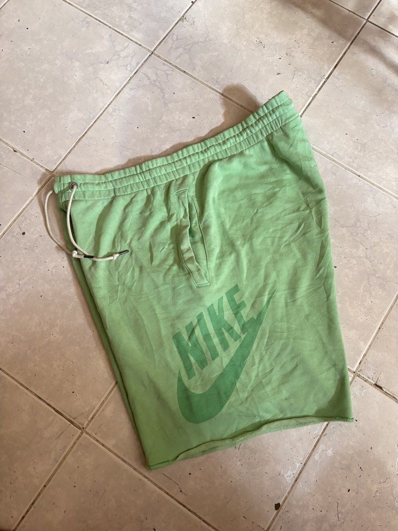 Nike Green Sweat Shorts XL (Category: Shorts) located in Manila. Submitted by manifest_05 (Listing ID 1461328272, Image 1). Description: - Green Nike sweat shorts - Size XL - Features printed Nike logo on front - Elastic waistband with drawstring - Minor flaw: small hole on the side (refer to last photo) - Made in China.