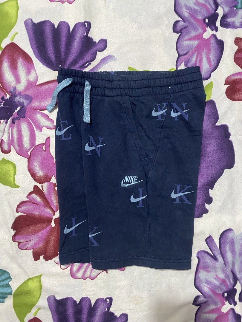 Nike Navy All Over Logo Shorts Size M (Category: Shorts) located in Las Pinas. Submitted by johnpaul2525 (Listing ID 1461326200, Image 1). Description: - Navy blue Nike shorts - All-over repeating Nike logo pattern - Elastic waistband with drawstring - Two side pockets - Made in Vietnam - Size M.