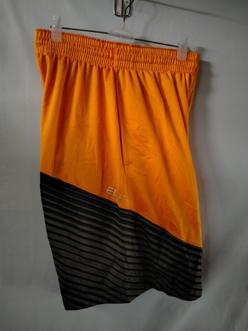 Nike Orange Basketball Shorts (Category: Shorts) located in Davao. Submitted by ervinpolino09 (Listing ID 1461431380, Image 3). Description: - Orange Nike basketball shorts - Elastic waistband with drawstring - Side pockets for convenience - Grey and black striped detail at the bottom - White Nike swoosh logo - Made in Thailand - Ideal for basketball, sports, or everyday casual wear Size 32-34 Length 19.5.