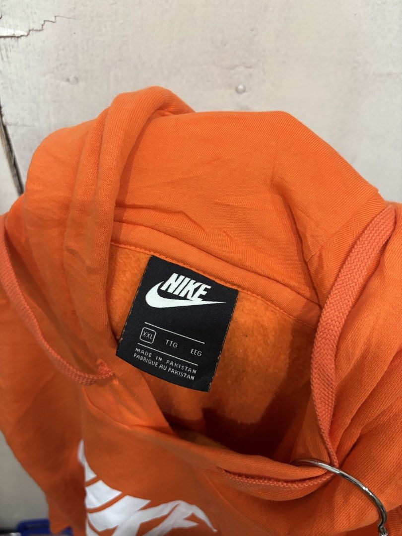 Nike Orange Hoodie Sweatshirt (Category: Coats, Jackets and Outerwear) located in Manila. Submitted by noribrahim.20 (Listing ID 1461372656, Image 3). Description: - Orange Nike Hoodie - Size XXL - White Swoosh Logo - Front Kangaroo Pocket - Made in Pakistan - Ideal for casual wear or workouts - Comfortable and stylish.