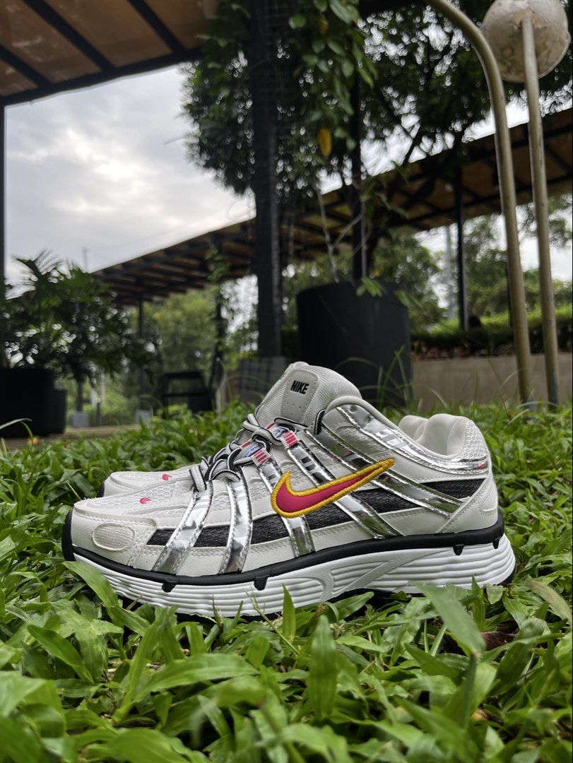Nike P-6000 Metallic Silver Pink Yellow (Category: Sneakers) located in Manila. Submitted by organicshoe (Listing ID 1461336293, Image 2). Description: - Nike P-6000 sneakers - Metallic silver colorway - Pink and yellow accents on the swoosh - Classic running shoe silhouette - Ideal for everyday wear or a sporty look - Features black and white laces (DIRECT MESSAGE FOR MORE DETAILED IMAGES).