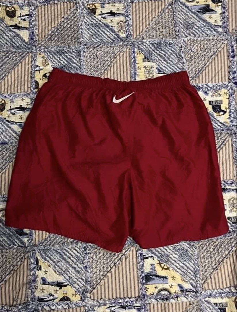 Nike Red Athletic Shorts Men's (Category: Shorts) located in Quezon City. Submitted by nathanzafra (Listing ID 1461485364, Image 2). Description: - Red Nike shorts - Elastic waistband with drawstring - Small white Nike swoosh logo on left leg - Two back pockets - Comfortable and lightweight material - Ideal for sports or lounging.