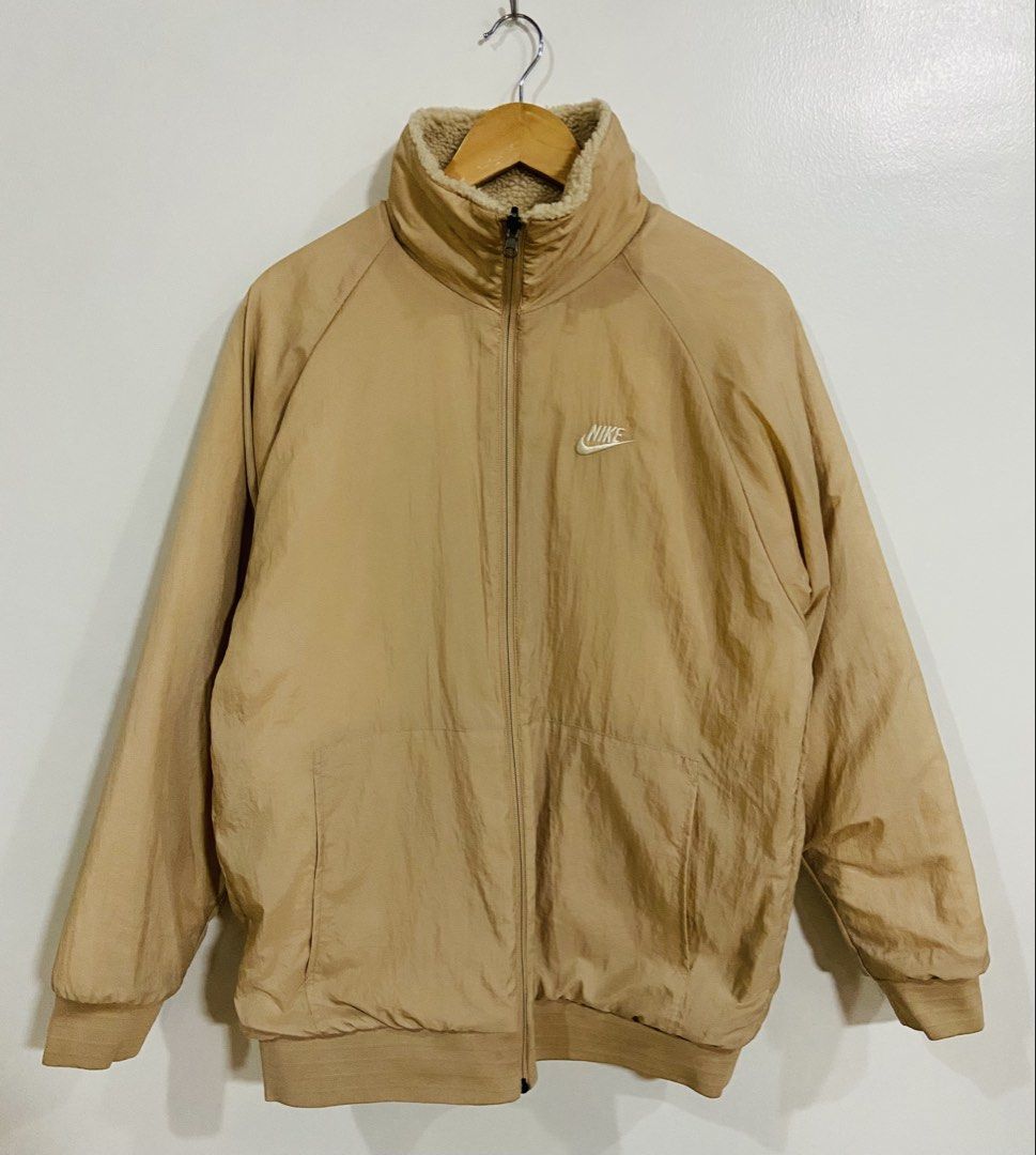 Nike Reversible Sherpa Fleece Jacket Tan (Category: Coats, Jackets and Outerwear) located in Manila. Submitted by thriftnijuan08 (Listing ID 1461339651, Image 2). Description: - Super cozy Nike jacket - Reversible design: Sherpa fleece on one side, smooth nylon on the other - Two front pockets on the fleece side - Perfect for staying warm - Made in Vietnam - Size L -Dimes 22/27.