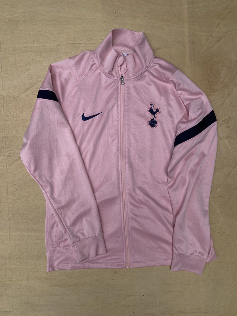 Nike Tottenham Hotspur Pink Track Jacket (Category: Coats, Jackets and Outerwear) located in Dalaguete. Submitted by gieloamahan127-17658 (Listing ID 1461395202, Image 1). Description: - Pink Tottenham Hotspur track jacket by Nike - Features the official club crest - Nike swoosh logo detail - Navy blue stripe accents on sleeves - Full zip closure - Perfect for any Spurs supporter.