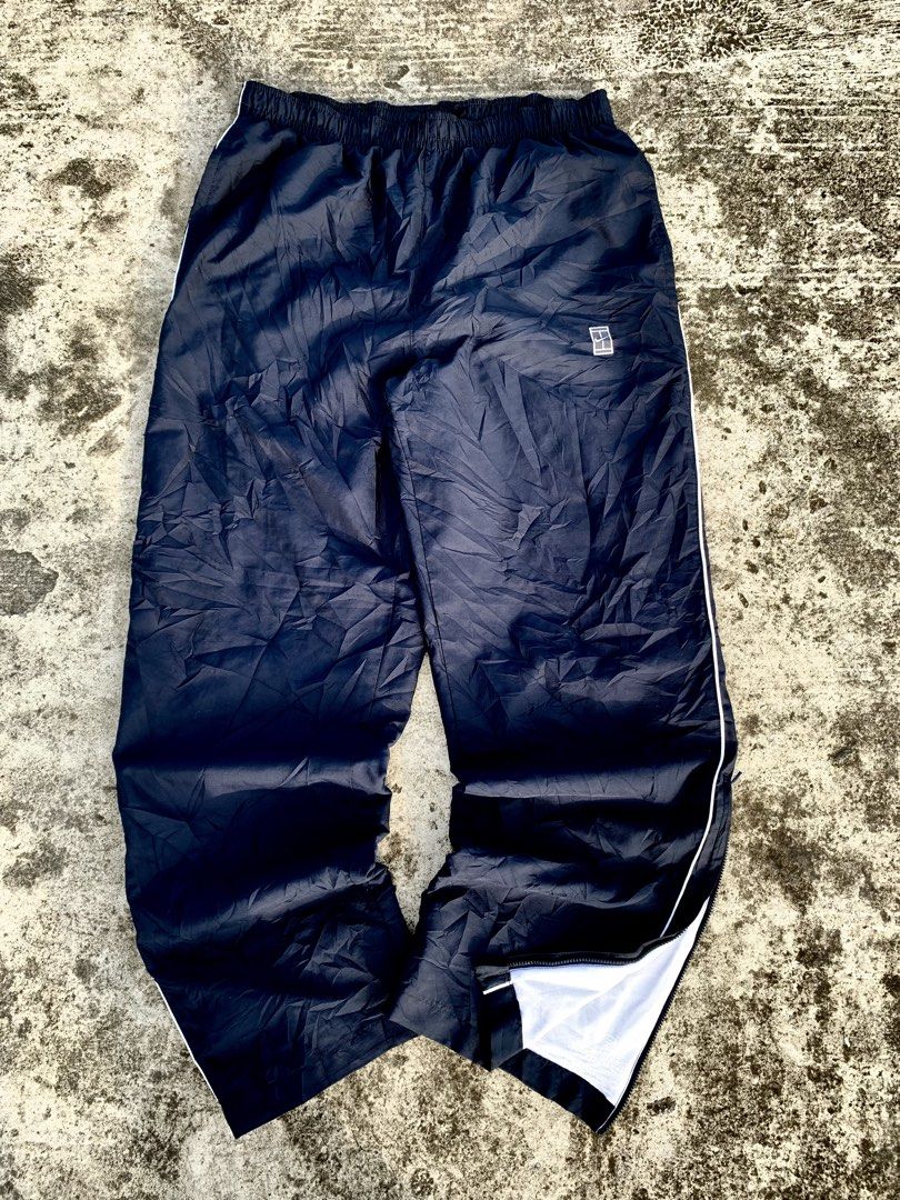 Nike Track Pants Navy Blue White Stripe (Category: Other Bottoms) located in Manila. Submitted by fiercefox.4ae806 (Listing ID 1461458774, Image 1). Description: - Navy blue track pants - White stripe detail down the side - Comfortable elastic waistband - Zippers at the ankle for adjustable fit - Versatile for sports or casual wear.