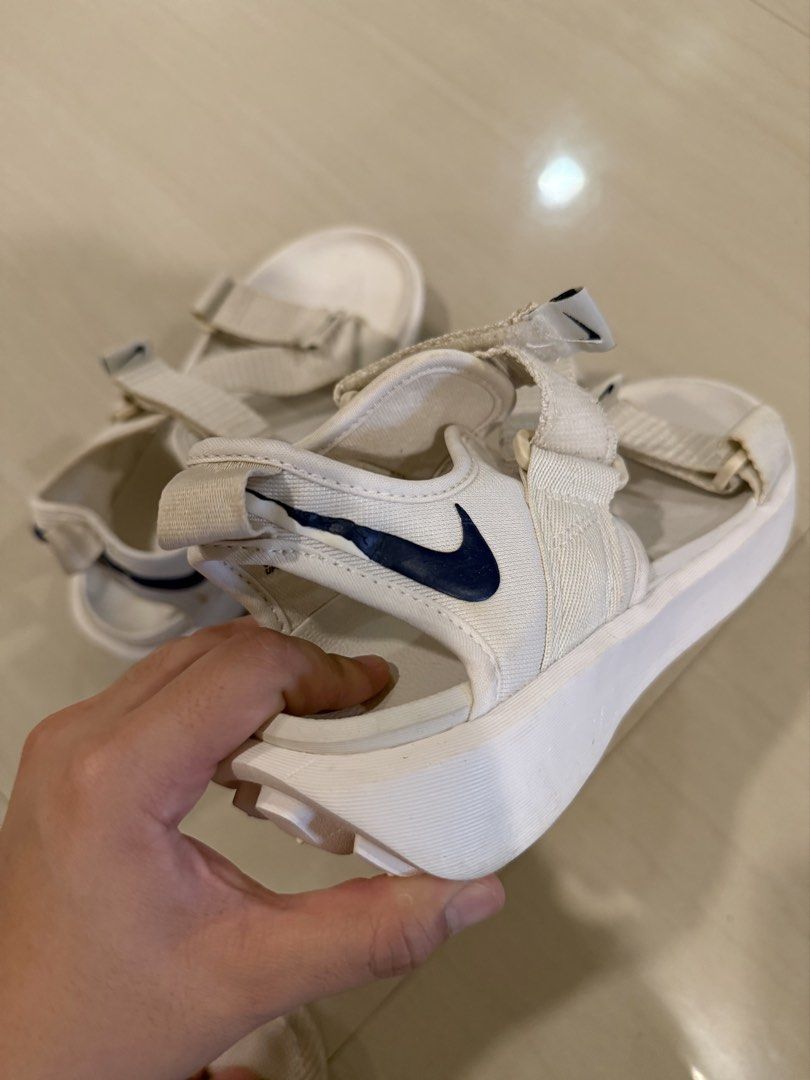 Nike White Sandals size 36 (Category: Flats & Sandals) located in Cagayan de Oro. Submitted by sugarrryyy (Listing ID 1461426831, Image 3). Description: - White Nike sandals - Classic navy blue Nike swoosh logo - Adjustable straps for a secure fit - Durable sole with excellent grip pattern - Comfortable for all-day wear - Ideal for casual outings and everyday use See photos for issues.