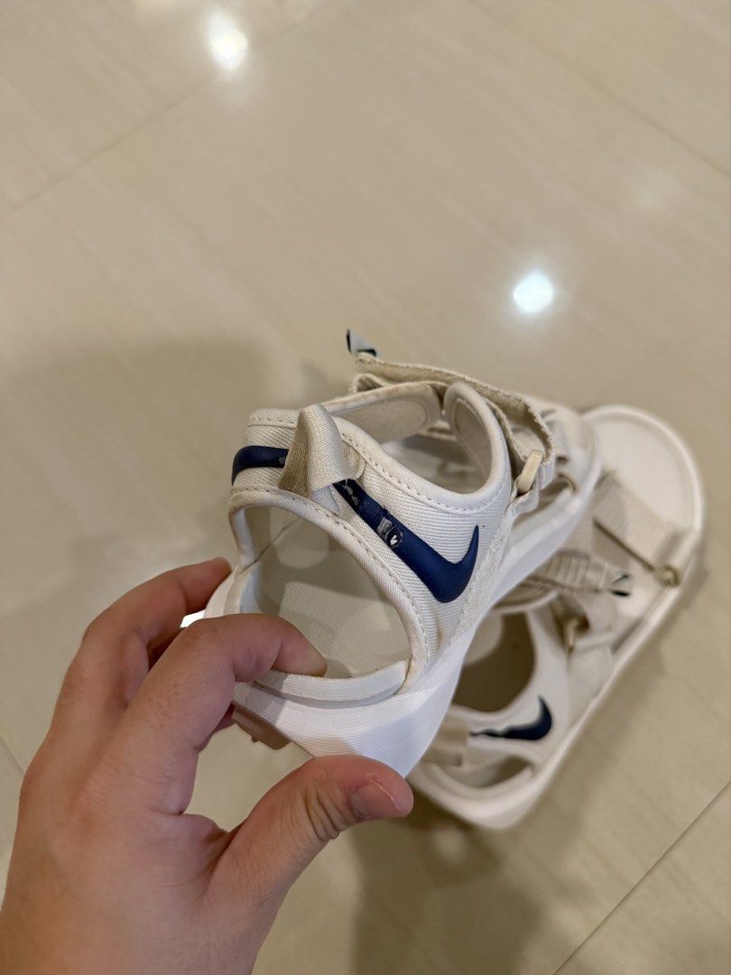 Nike White Sandals size 36 (Category: Flats & Sandals) located in Cagayan de Oro. Submitted by sugarrryyy (Listing ID 1461426831, Image 2). Description: - White Nike sandals - Classic navy blue Nike swoosh logo - Adjustable straps for a secure fit - Durable sole with excellent grip pattern - Comfortable for all-day wear - Ideal for casual outings and everyday use See photos for issues.