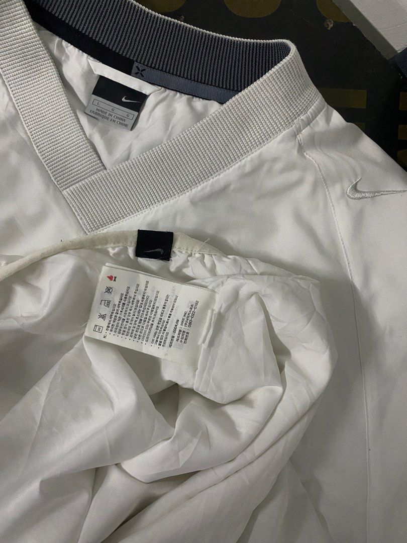 Nike White V-Neck Pullover Jacket (Category: Announcements) located in Santa Maria. Submitted by saintarchive316 (Listing ID 1461518099, Image 2). Description: - White Nike pullover jacket - V-neck design with grey sleeve accents - Elasticated hem and cuffs - Ideal for layering or light workouts - Made in China.