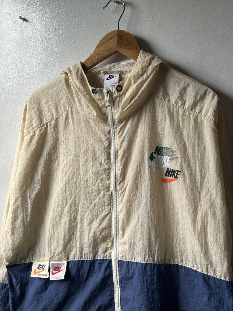 Nike Windbreaker Jacket Beige Blue Color Block (Category: Coats, Jackets and Outerwear) located in Amadeo. Submitted by archived_stole (Listing ID 1461472347, Image 2). Description: Nike Sportswear Lightweight Breathable Woven Jacket Dimension: 23.5” Width 28”Length Condition: Good to Excellent! Color rate: 9.5/10 issue: crack, missing lace, stain (not visible) Pm/Dm📥 Jnt/Lalamove🛵.