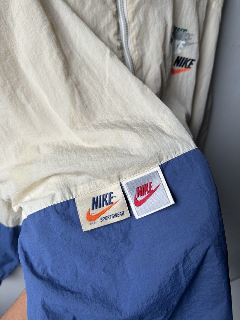 Nike Windbreaker Jacket Beige Blue Color Block (Category: Coats, Jackets and Outerwear) located in Amadeo. Submitted by archived_stole (Listing ID 1461472347, Image 3). Description: Nike Sportswear Lightweight Breathable Woven Jacket Dimension: 23.5” Width 28”Length Condition: Good to Excellent! Color rate: 9.5/10 issue: crack, missing lace, stain (not visible) Pm/Dm📥 Jnt/Lalamove🛵.