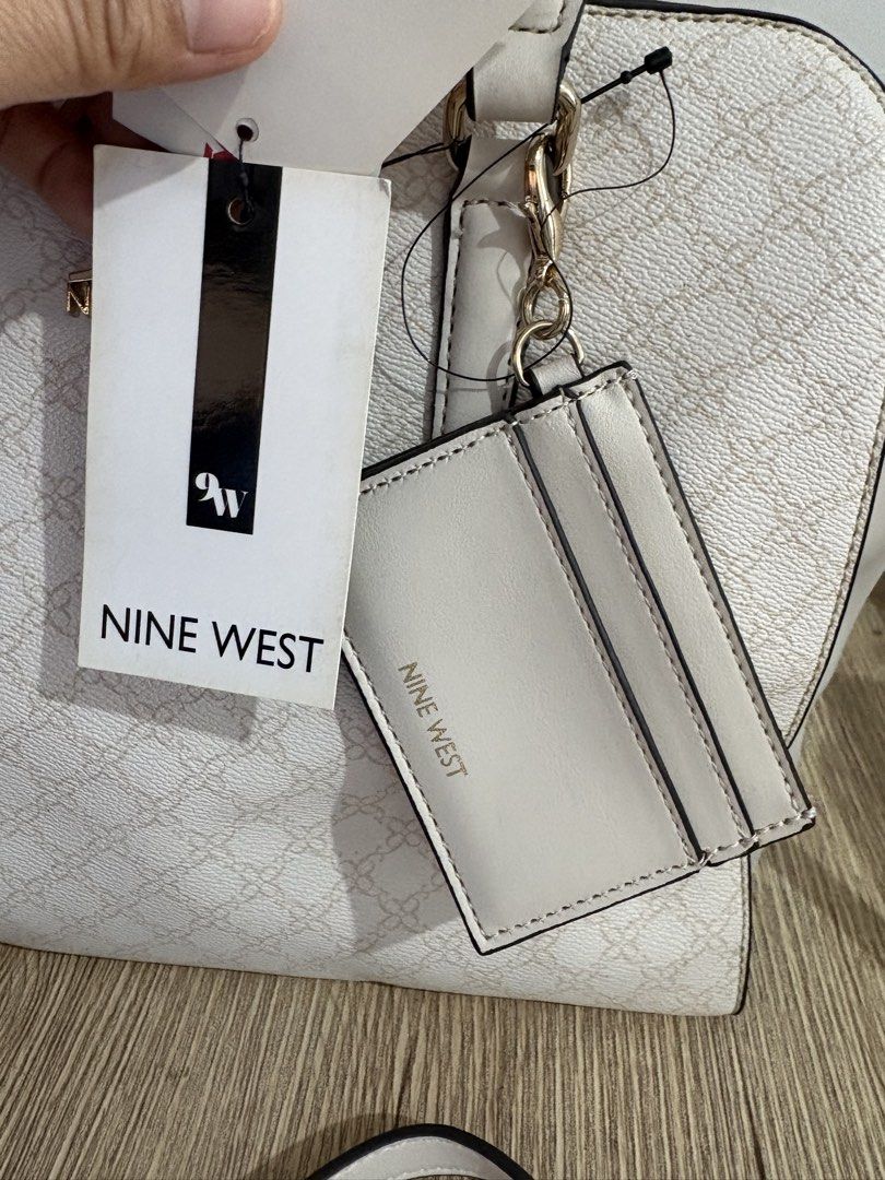 Nine West Devynn Vanilla Logo Shoulder Bag (Category: Shoulder Bags) located in Taguig. Submitted by blissdreana (Listing ID 1461505043, Image 3). Description: Brand new with tag Imported from Hawaii Includes removable card case Zip closure Spacious.