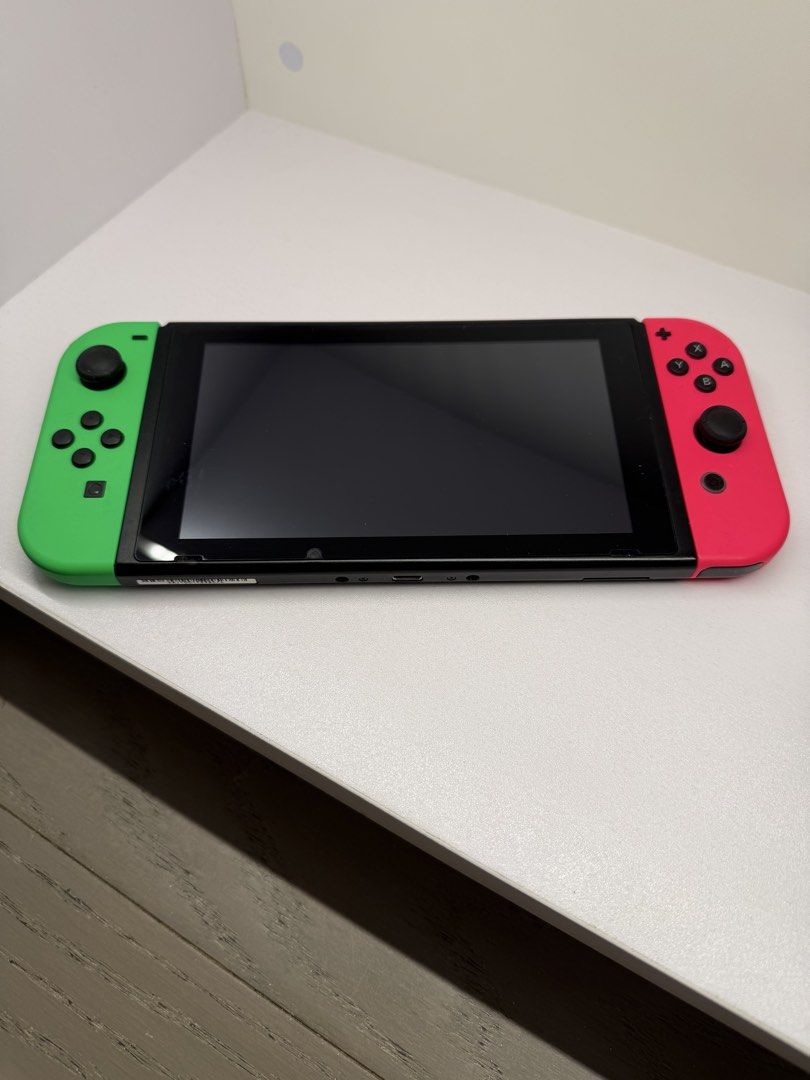 Nintendo Switch Console - Neon Red/Blue Joy-Cons (Category: Nintendo) located in Makati City. Submitted by arkera.274 (Listing ID 1461342744, Image 1). Description: - Nintendo Switch Console - Neon Red & Neon Green Joy-Cons included - Clear, scratch-free screen - Back features Nintendo Switch logo - Ready for immediate gaming! No box or charger but works perfectly .