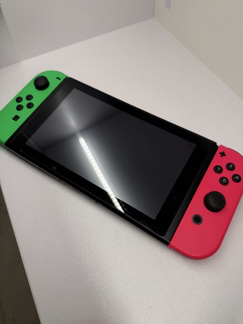 Nintendo Switch Console - Neon Red/Blue Joy-Cons (Category: Nintendo) located in Makati City. Submitted by arkera.274 (Listing ID 1461342744, Image 2). Description: - Nintendo Switch Console - Neon Red & Neon Green Joy-Cons included - Clear, scratch-free screen - Back features Nintendo Switch logo - Ready for immediate gaming! No box or charger but works perfectly .