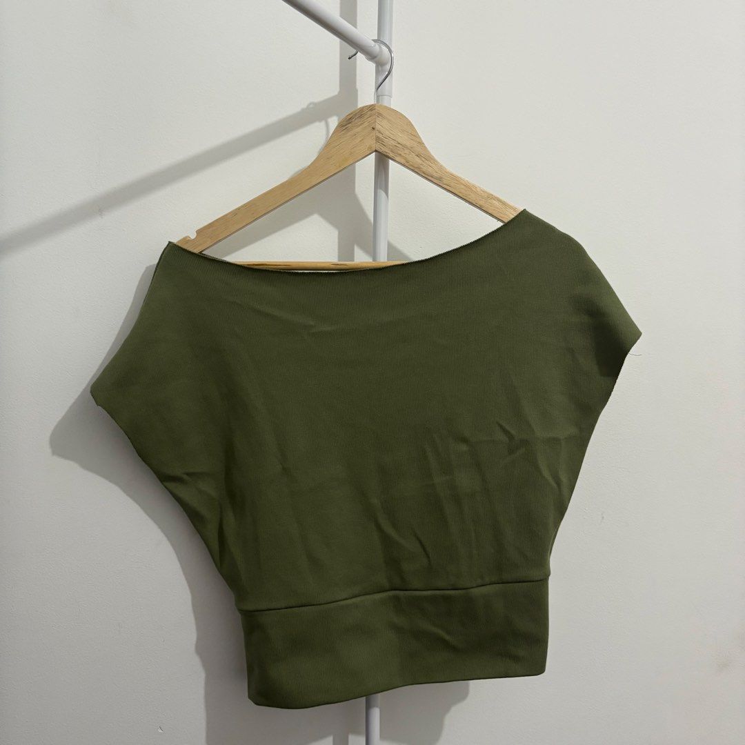 Off-Shoulder Batwing Sleeve Top (Olive) (Category: Blouses) located in Quezon City. Submitted by thisisshobe (Listing ID 1461474211, Image 1). Description: 🌊 NOTE: Kindly read the reminders posted in the product slideshow. Follow us on our Social Media Page: Sunny Clothing PH 🌞 ——— 💫 Product Information • Brand: N/A • Size: Medium • Details: Rib Knitted Fabric | Used Once.