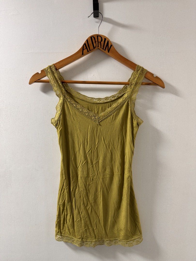 Olive Green Lace Trim Tank Top (Category: Sleeveless) located in Cavite. Submitted by aldrindela40142 (Listing ID 1461535004, Image 1). Description: - Olive green tank top - V-neck design - Lace trim on neckline and hem - Soft and comfortable fabric - Versatile for layering or wearing alone - Easy to style with various outfits.