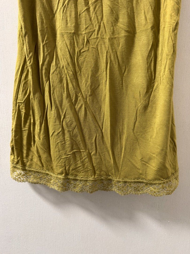 Olive Green Lace Trim Tank Top (Category: Sleeveless) located in Cavite. Submitted by aldrindela40142 (Listing ID 1461535004, Image 3). Description: - Olive green tank top - V-neck design - Lace trim on neckline and hem - Soft and comfortable fabric - Versatile for layering or wearing alone - Easy to style with various outfits.