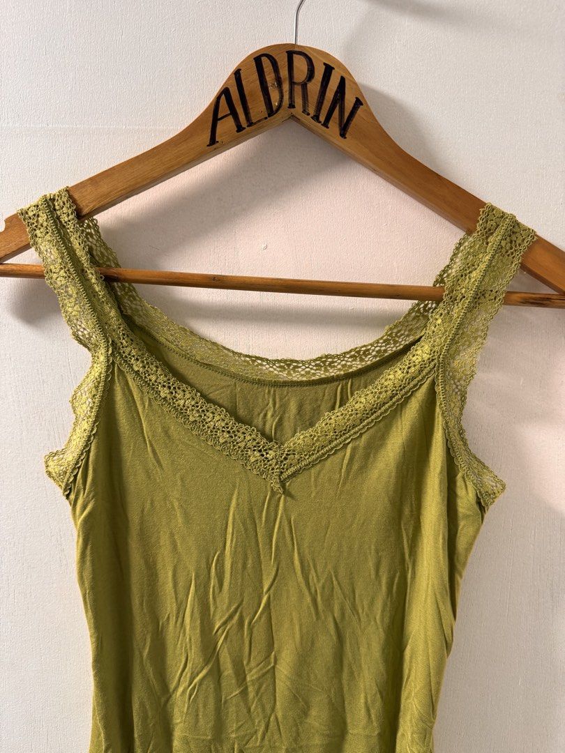 Olive Green Lace Trim Tank Top (Category: Sleeveless) located in Cavite. Submitted by aldrindela40142 (Listing ID 1461535004, Image 2). Description: - Olive green tank top - V-neck design - Lace trim on neckline and hem - Soft and comfortable fabric - Versatile for layering or wearing alone - Easy to style with various outfits.