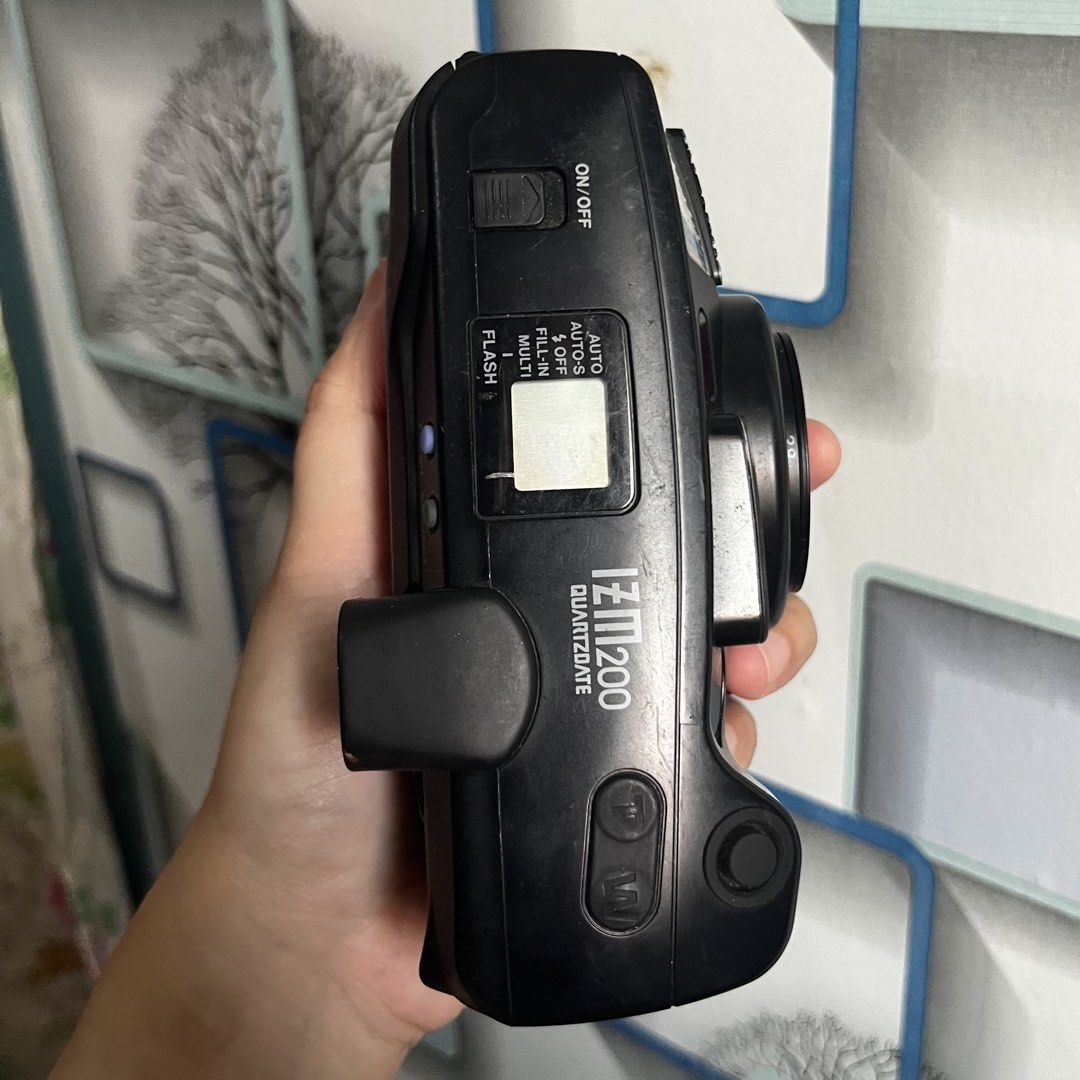 Olympus iZM 200 Quartzdate Multi AF Zoom 38-80mm Camera (Category: Cameras) located in San Fernando. Submitted by kadwa.collect (Listing ID 1461365167, Image 3). Description: - Olympus iZM 200 Quartzdate 35mm film camera - Clean battery and film compartment - Working; Film tested, zoom, shutter, & film rewind - Not working; Flash Loc: Mexico, Pampanga .