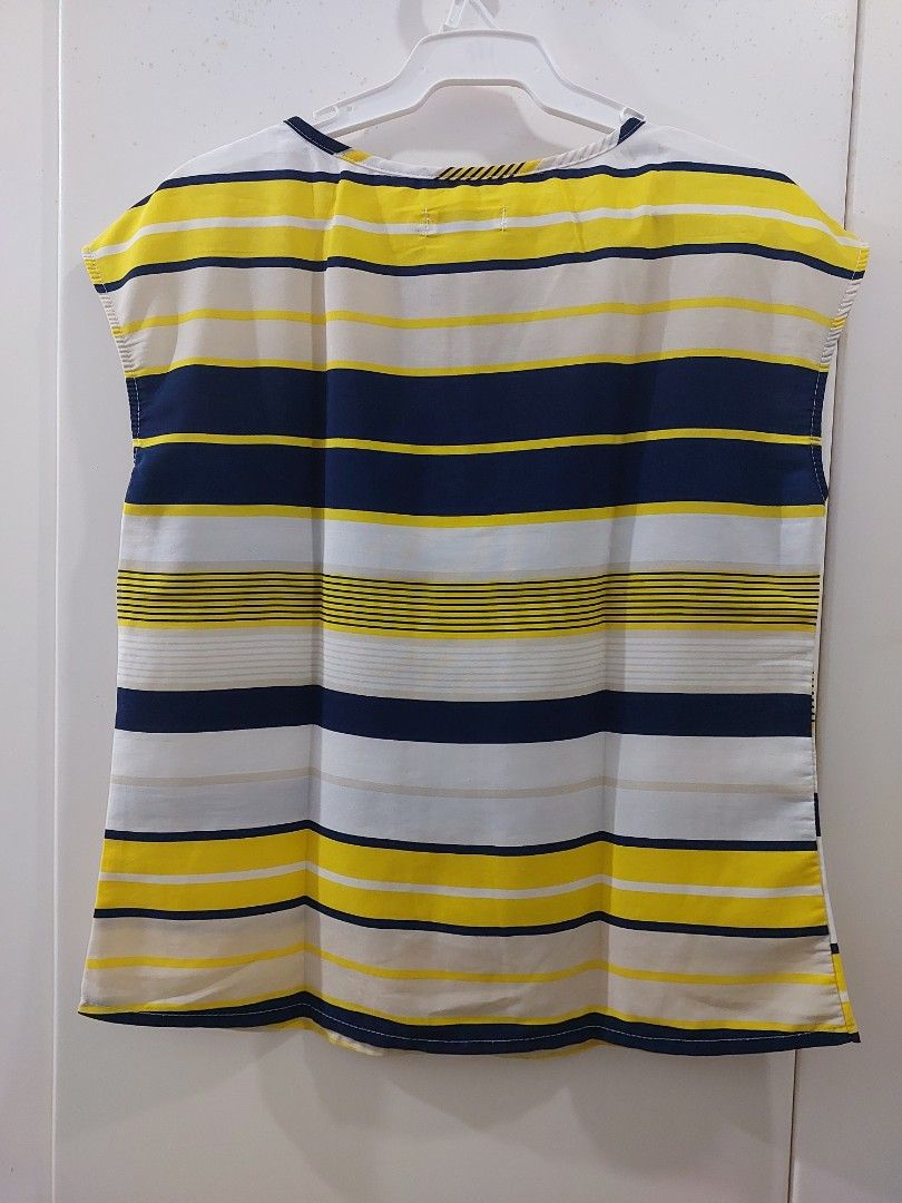 Oor Chin Striped Top (Category: Others Tops) located in Makati City. Submitted by yishanjade (Listing ID 1461461908, Image 2). Description: - Brand: Oor Chin - Pattern: Yellow, navy, and white stripes - Neckline: Keyhole detail - Material: Lightweight - Style: Casual wear - Versatile: Easy to pair with jeans or shorts.