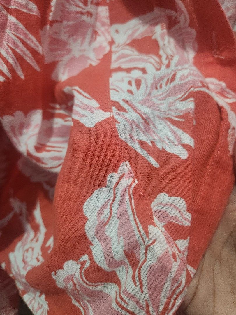 Orange Floral Print Tie-Front Top (Category: Blouses) located in Muntinlupa City. Submitted by yanyan1888 (Listing ID 1461366215, Image 2). Description: - Cute orange top with white floral print - Features a tie-front detail - Button closure - Lightweight and airy fabric - Ideal for casual outings or beach vacations - Easily styled with shorts or jeans.