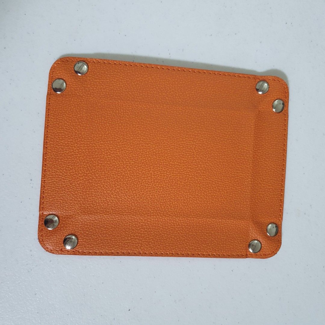 Orange Leather Foldable Catchall Tray (Category: Other Home Decor) located in Paranaque City. Submitted by cobien (Listing ID 1461408550, Image 2). Description: - Chic orange leather tray - Snaps together to form a convenient small dish - Ideal for organizing keys, coins, or small accessories - Folds flat for effortless storage - 6 pcs available - Dimensions (flat): 7 x 5.5 inches - Dimensions (folded): Approximately 3.25 x 4.75 inches - Perfect 