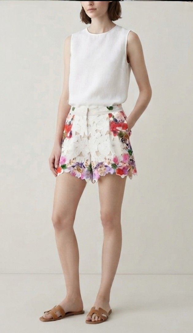 Orchid Embroidered Guipure Shorts (Category: Shorts) located in Donsol. Submitted by saksthriftavenuebyluckymaria8 (Listing ID 1461456791, Image 2). Description: - White guipure lace shorts - Vibrant floral embroidery - High-waisted design - Scalloped hem --Perfect for summer occasions - Pair with a simple top for a chic Look white orchid-embroidered guipure lace shorts with a scalloped hem . not stretchable 4 fits sz 30 waist 15in hips 25in leng