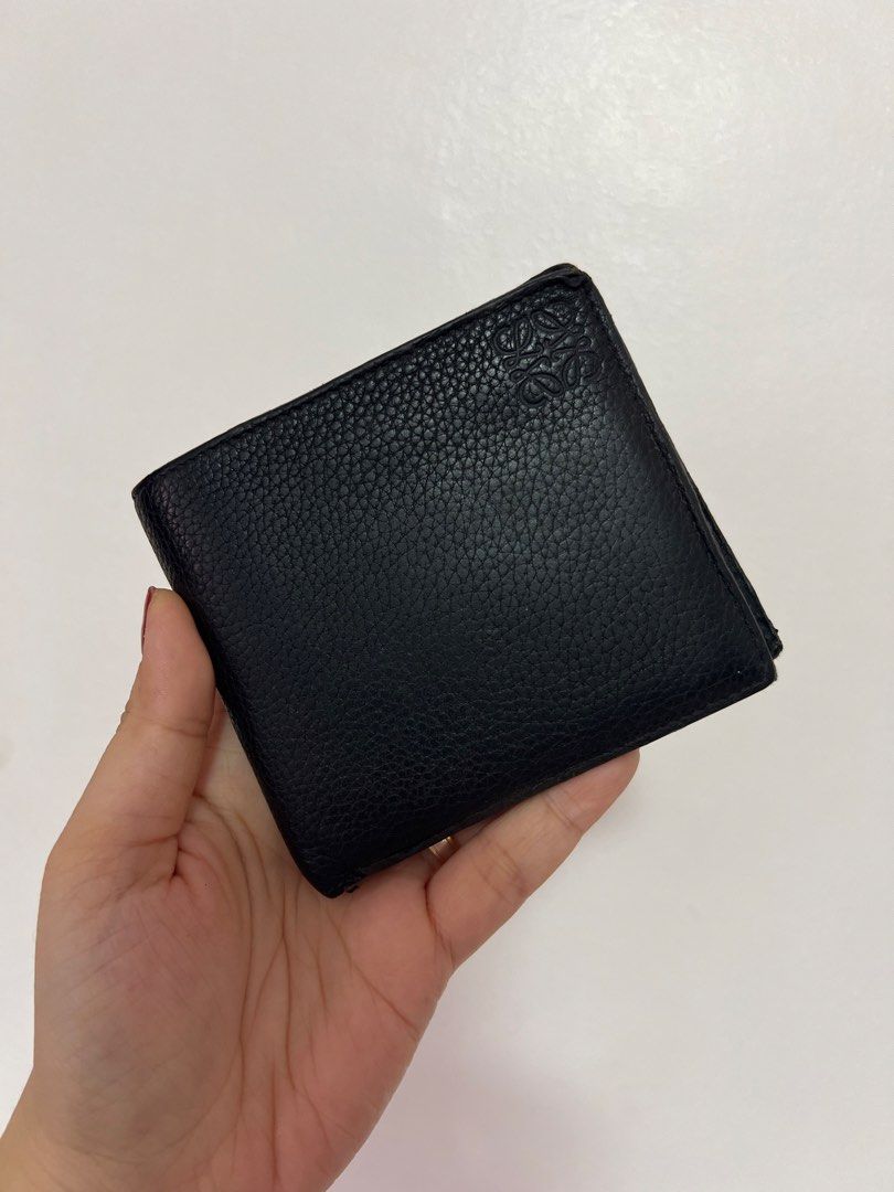 Original Loewe Black Leather Bifold Wallet (Category: Luxury Bags & Wallets) located in Cavite. Submitted by newtoyou88 (Listing ID 1461340342, Image 1). Description: - Authentic Loewe bifold wallet - Material: Black pebbled leather - Features: Multiple card slots - Design: Classic and timeless - Condition: Good, with some signs of wear - Ideal for: Everyday use.