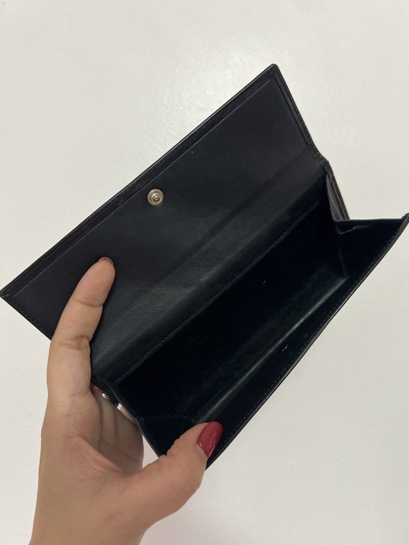Original Loewe Black Leather Long Wallet (Category: Luxury Bags & Wallets) located in Cavite. Submitted by newtoyou88 (Listing ID 1461340551, Image 3). Description: - Authentic black leather Loewe wallet - Multiple card slots for ample storage - Main compartment for cash - Secure snap button closure - Expertly crafted in Spain -Vintage.