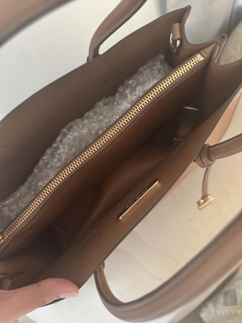 Original MK office bag (Category: Shoulder Bags) located in Davao. Submitted by lovedbyejane (Listing ID 1461503299, Image 2). Description: Selling preloved MK book tote. (with tag and extra strap for sling) good as new (with minimal signs of usage only) original price: 11k selling price: 5k.