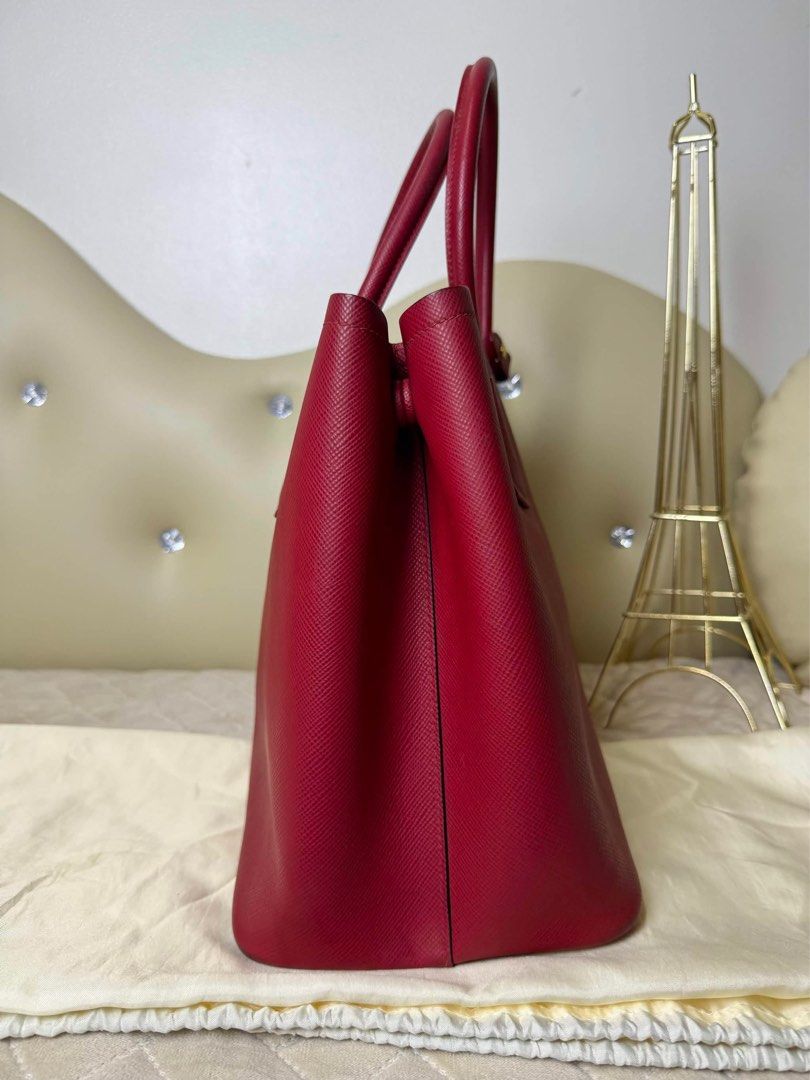 Original Prada Saffiano Red Bag (Category: Luxury Bags & Wallets) located in Cavite. Submitted by authenticbagshavenbyvalg (Listing ID 1461332359, Image 3). Description: Guaranteed Original 💯 excellent condition sa labas ung sa loob pls check last pic ( need lang top edge coat ) 1,800 as per repair shop overall still in very good condition Kayo na magpagawa.