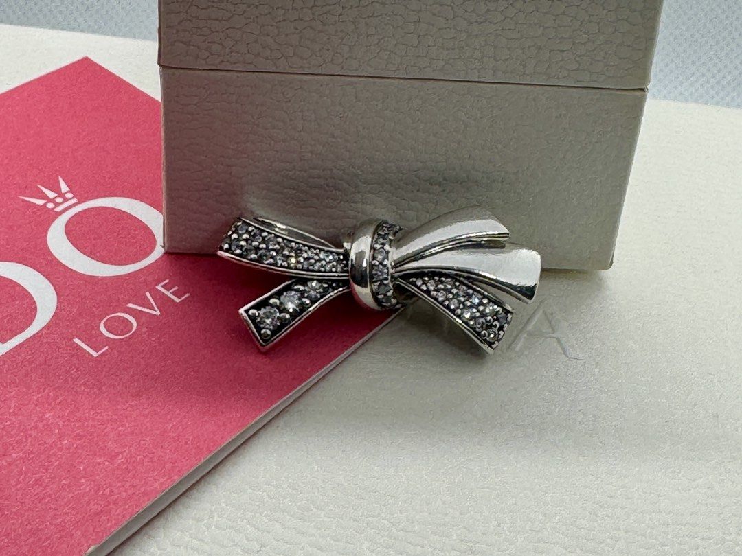 Pandora "Brilliant Bow" Oversized Charm (797241CZ) (Category: Charms) located in Cabanatuan. Submitted by water.withahintoflime (Listing ID 1461445541, Image 1). Description: Retired|Authentic S925 with Clear CZ P2 S925 ALE Hallmark Pre-owed|No issue|Normal wear With Complete Packaging.