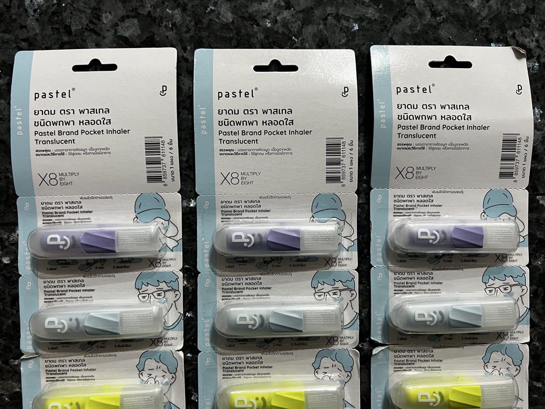 Pastel brand pocket inhaler (Category: Medical Supplies & Tools) located in Makati City. Submitted by gabbbbb. (Listing ID 1461507512, Image 2). Description: * Brand: Pastel * Product: Pocket Inhaler * Type: Translucent * Packaging: 6 inhalers per pack * Compact, portable design with a protective clear case * Shown in several pastel/translucent colors, including purple, gray/blue, and bright yellow * Thai-language packaging, indicating it is a Th