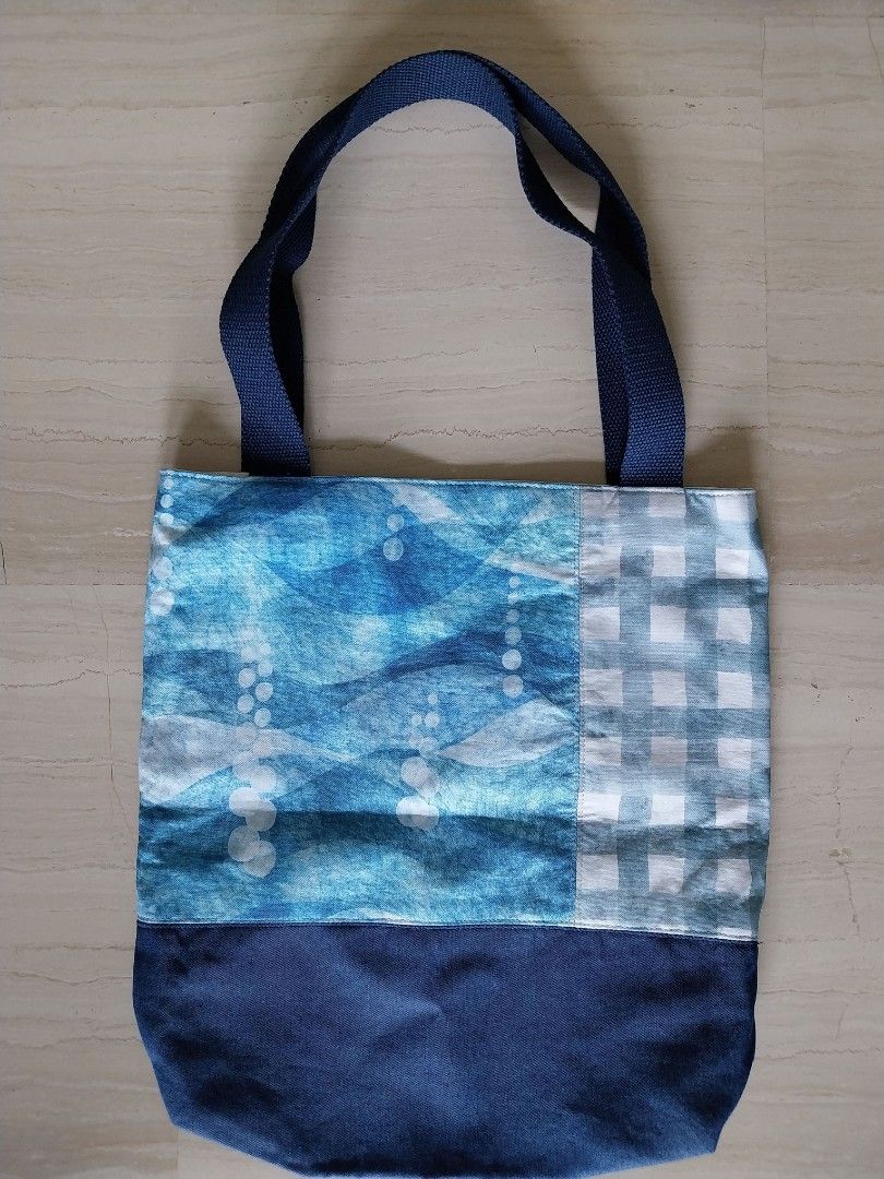Patchwork Tote Bag (Category: Tote Bags) located in Singapore. Submitted by TTS11 (Listing ID 1461394908, Image 2). Description: - dim 30 x 30 x 5.5 cm - double-layered - outer layer: fabric mix of tie-dye and gingham check - inner layer: fabric lining with a pocket and red and black plaid base - intricate workmanship.