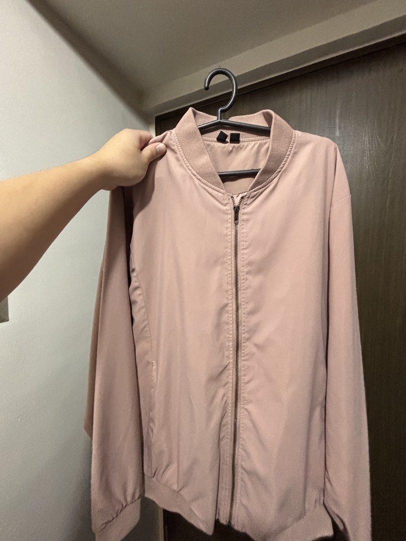 Penshoppe Bomber Jacket (Men’s, Large) (Category: Coats, Jackets and Outerwear) located in Mandaluyong City. Submitted by jacobsss23 (Listing ID 1461483170, Image 1). Description: - Pink bomber jacket from Penshoppe - Size: L - Classic bomber style with zip-up front - Features ribbed collar, cuffs, and hem - Ideal for layering and casual outfits.