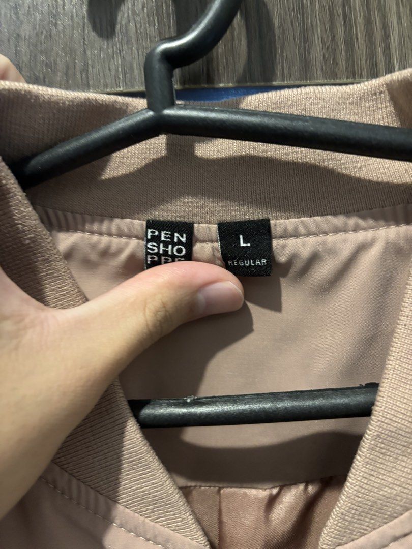 Penshoppe Bomber Jacket (Men’s, Large) (Category: Coats, Jackets and Outerwear) located in Mandaluyong City. Submitted by jacobsss23 (Listing ID 1461483170, Image 3). Description: - Pink bomber jacket from Penshoppe - Size: L - Classic bomber style with zip-up front - Features ribbed collar, cuffs, and hem - Ideal for layering and casual outfits.