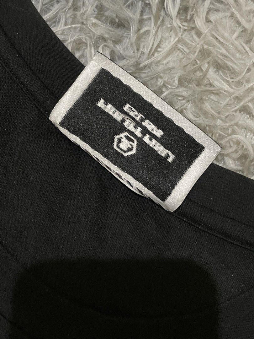 Philipp Plein Black T-Shirt with Hexagonal Logo (Category: Tshirts & Polo Shirts ) located in Manila. Submitted by khen23_408 (Listing ID 1461544962, Image 3). Description: - Authentic Philipp Plein black t-shirt - Size 56 - Iconic hexagonal PP logo with silver embellishments - Comfortable fabric - Ideal for casual wear or making a statement - Check label for material details.