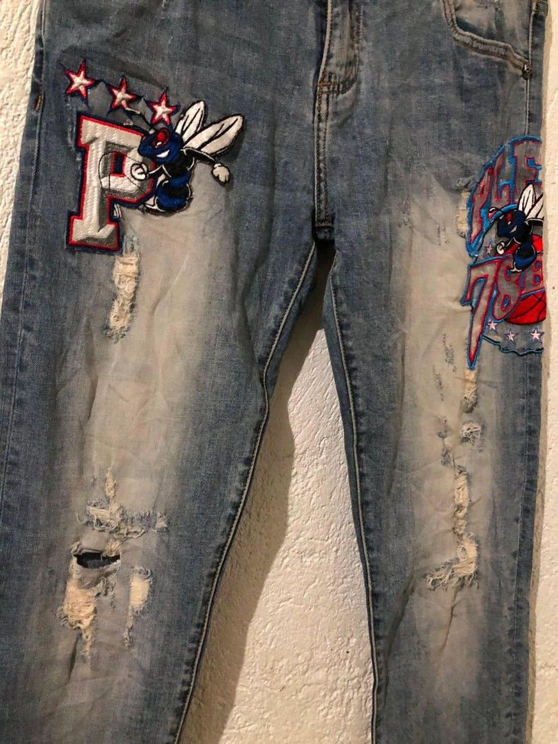 PHILIPP PLEIN JEANS 31/32(41) (Category: Jeans) located in Manila. Submitted by kuyanyo (Listing ID 1461545460, Image 3). Description: - Light wash denim jeans - Distressed details and unique patches on the front - Patches include 'P' with stars and bee, and 'PLEIN 76ERS' with bee and basketball - Button and zip fly closure - Belt loops - Back pockets - Perfect statement piece for your wardrobe DM IF INTIRESTED EXCELLENT CONDITION NO ISSUE CAN DO
