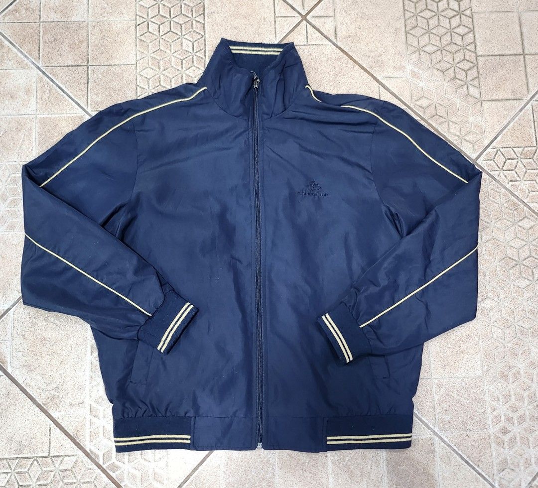 Pierre Balmain Navy Blue Track Jacket (Category: Coats, Jackets and Outerwear) located in Baguio. Submitted by analon (Listing ID 1461476186, Image 2). Description: - Navy blue Pierre Balmain track jacket - Size: L - Yellow piping along sleeves and collar - Embroidered logo on chest - Zip-up front closure - Ribbed cuffs and hem - Ideal for casual wear.