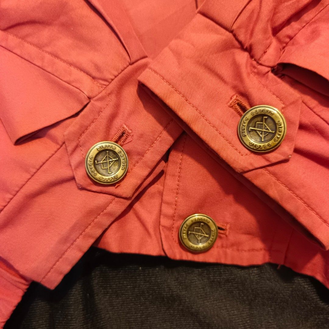 Pierre Cardin Red Jacket (Category: Coats, Jackets and Outerwear) located in Currimao. Submitted by jerson120 (Listing ID 1461364206, Image 3). Description: - Authentic Pierre Cardin red jacket - Embroidered brand name on the front - Button closures on cuffs and front - Stylish patterned trim on the collar - Ideal for layering over outfits.