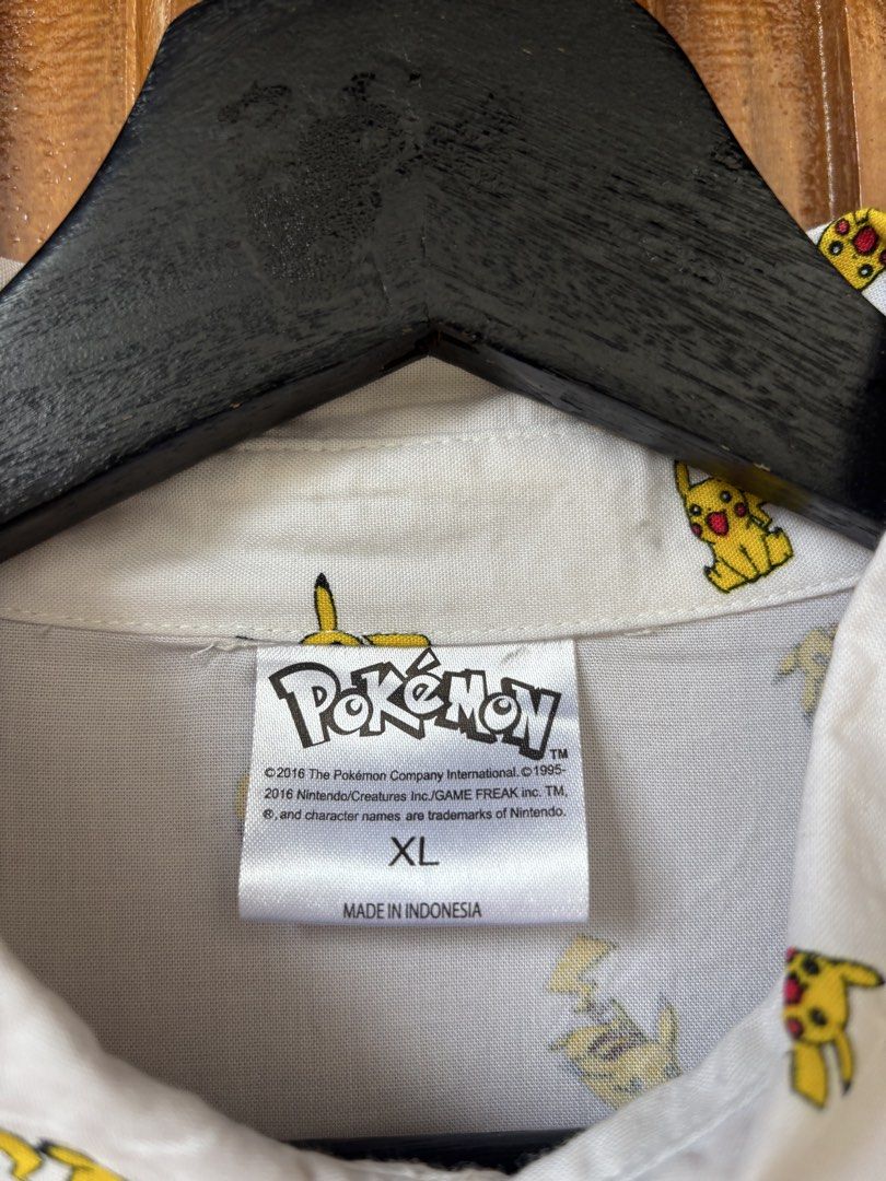 Pikachu AOP White Button Down Short Sleeve Polo🤍 (Category: Formal Shirts) located in Maasin. Submitted by chevyferna66833 (Listing ID 1461412789, Image 2). Description: Pikachu AOP White Button Down XL Short Sleeve Polo ©2016 Medium fitting Length 27 Width 20 Excellent condition Mine 900.