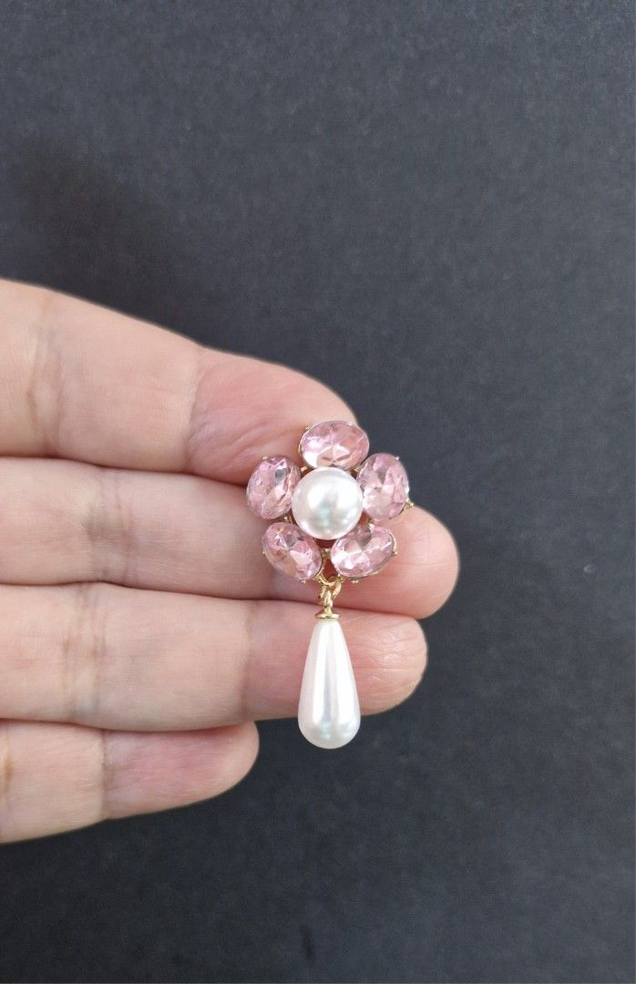 Pink Flower Pearl Brooch (Category: Brooches) located in Taguig. Submitted by mommaschoice (Listing ID 1461362443, Image 2). Description: Brand New Adorned w/ faux pearl Lightweight won't damage the fabric Ships nationwide.