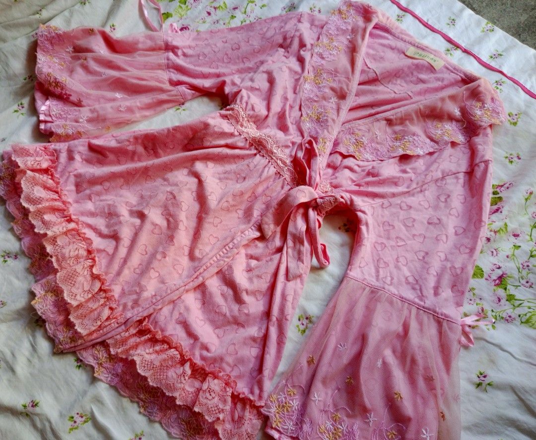 Pink Heart Pattern Kimono Robe with Lace Trim (Category: Undergarments & Loungewear) located in Kalibo. Submitted by chinxecloset (Listing ID 1461498272, Image 2). Description: - Adorable pink kimono robe - Features a subtle all-over heart pattern - Stylish bell sleeves with sheer lace trim - Elegant ruffled lace hem - Comes with a matching tie belt - Versatile: Ideal for lounging at home or as a chic cover-up.