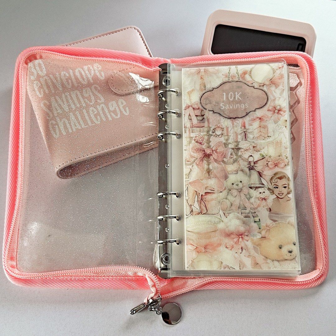 Pink Savings Challenge Kit with Calculator & Binder (Category: Other Stationery & Craft) located in Cebu City. Submitted by jycn.p (Listing ID 1461346549, Image 2). Description: - Adorable pink savings challenge kit. - Includes a hexagonal calculator. - Comes with a binder featuring 30 envelope savings challenge inserts. - Separate zipper pouch for cash or cards. - Ideal for budgeting and kickstarting your savings goals..