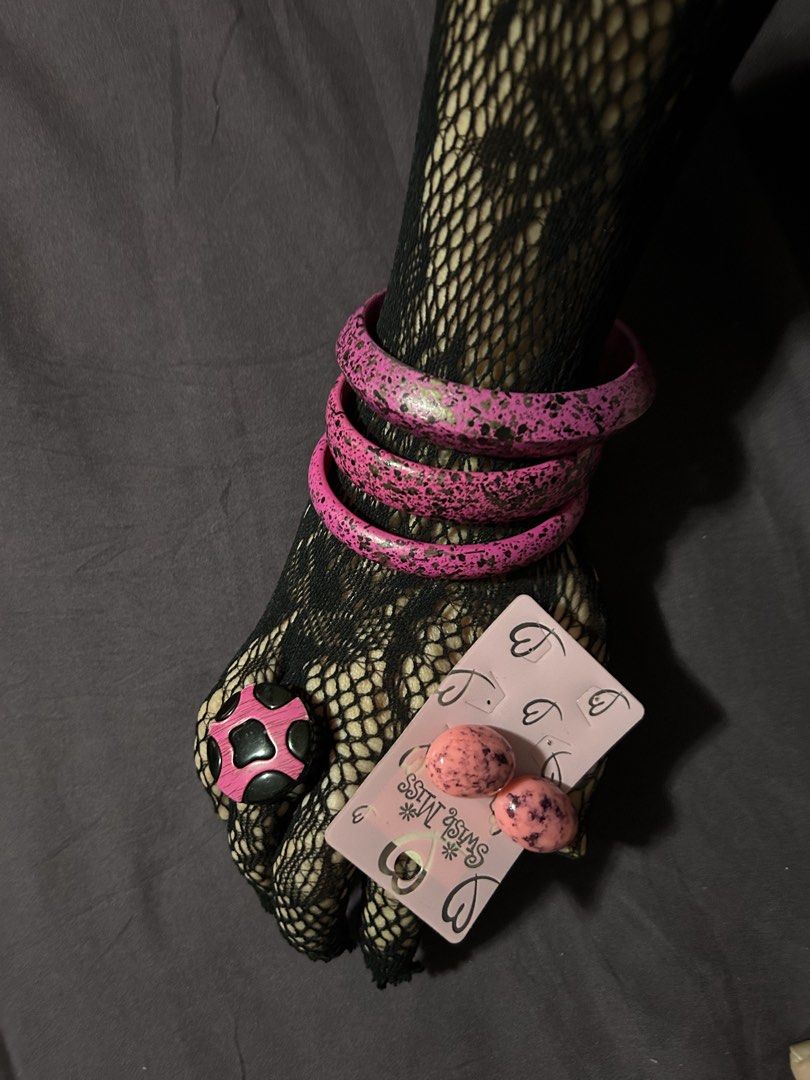 Pink Splatter Bangles, Ring, and Swish Miss Earrings Set (Category: Earrings) located in Pasig City. Submitted by mixpicks (Listing ID 1461364895, Image 2). Description: - Funky pink splatter bangles (stackable!) - Matching pink splatter ring with black details - Pair of pink speckled oval earrings from Swish Miss - Perfect for adding a playful pop of color to any outfit - All pieces feature unique, playful designs - Take all.