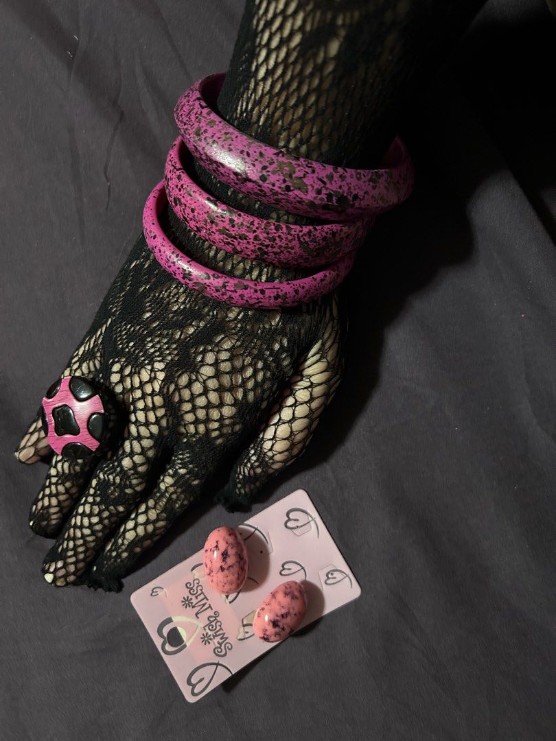 Pink Splatter Bangles, Ring, and Swish Miss Earrings Set (Category: Earrings) located in Pasig City. Submitted by mixpicks (Listing ID 1461364895, Image 3). Description: - Funky pink splatter bangles (stackable!) - Matching pink splatter ring with black details - Pair of pink speckled oval earrings from Swish Miss - Perfect for adding a playful pop of color to any outfit - All pieces feature unique, playful designs - Take all.