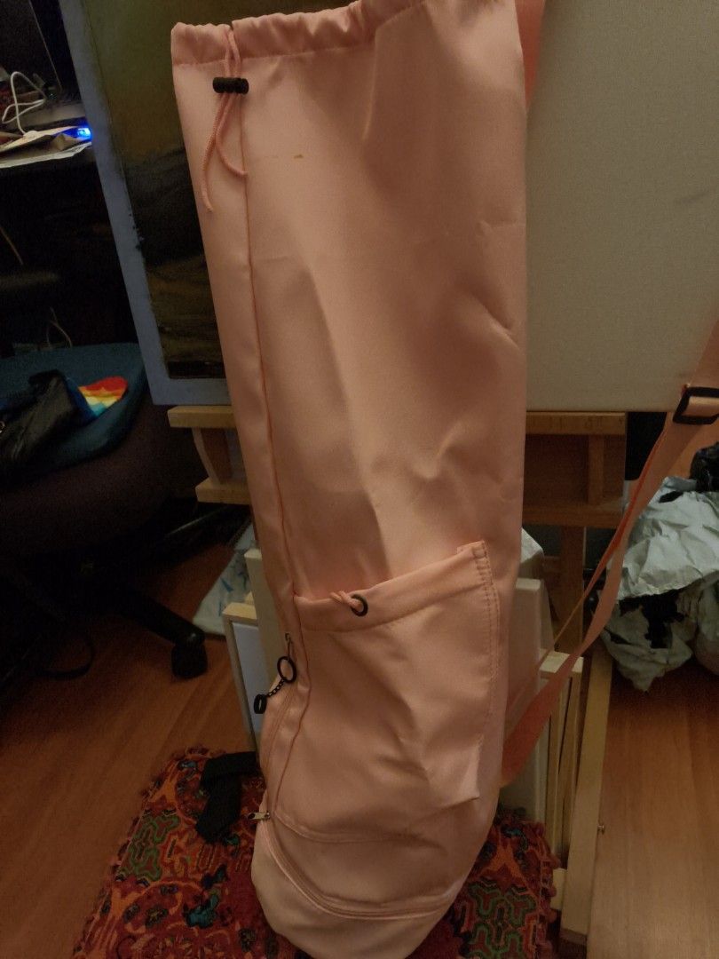 Pink Yoga Mat Bag with Pockets (Category: Exercise Mats) located in Quezon City. Submitted by trace.abella (Listing ID 1461434041, Image 1). Description: - Adorable pink yoga mat bag - Secure drawstring closure at the top - Convenient zippered pocket at the bottom for essentials - Handy side slip pocket - Adjustable strap for comfortable carrying - Ideal for transporting your yoga mat and accessories.