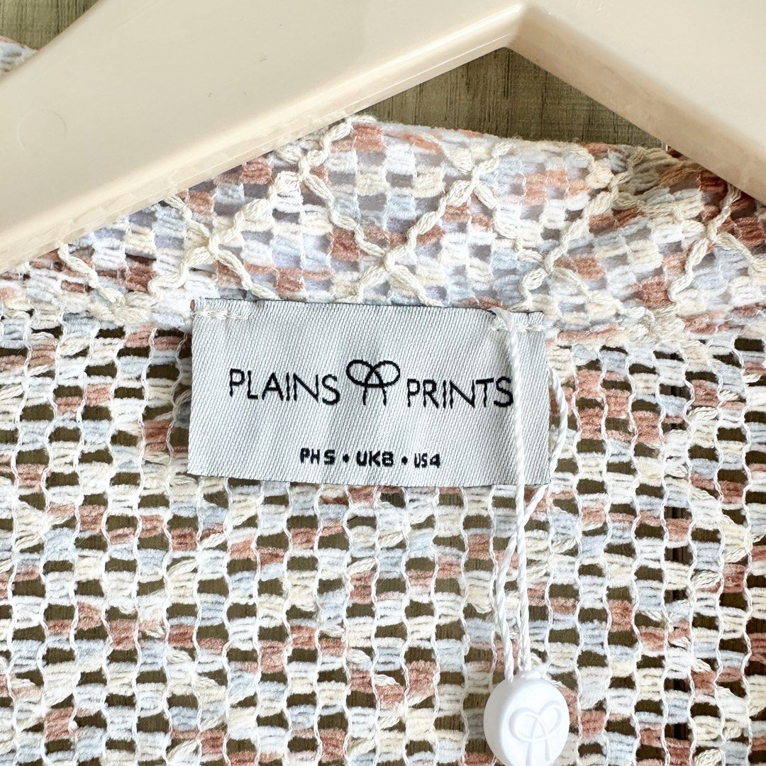 PLAINS & PRINTS - Crochet Buttondown (Category: Others Tops) located in Makati City. Submitted by alilbitofeverything.ph (Listing ID 1461372387, Image 3). Description: 📍Makati Brand: Plains & Prints Size on tag: small Fits small-large (depends on the fit you want) Brand new Still with tags Original Price: ₱2,098 Selling for: ₱1,050 No flaws.
