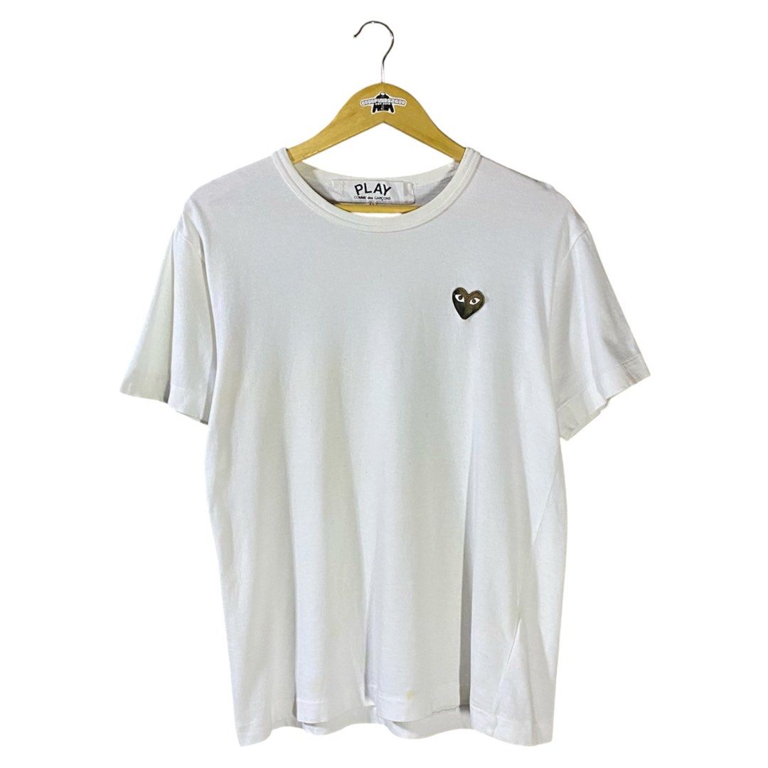 Play CDG Logo Shirt (Category: Tshirts & Polo Shirts ) located in Baguio. Submitted by goodfinds2600v2 (Listing ID 1461502026, Image 1). Description: Size on tag: M Dimensions: L-26 W/Bust-19.5 Description: unisex Condition: Good Issue/s: bleach stone on patch logo, yellow stains .