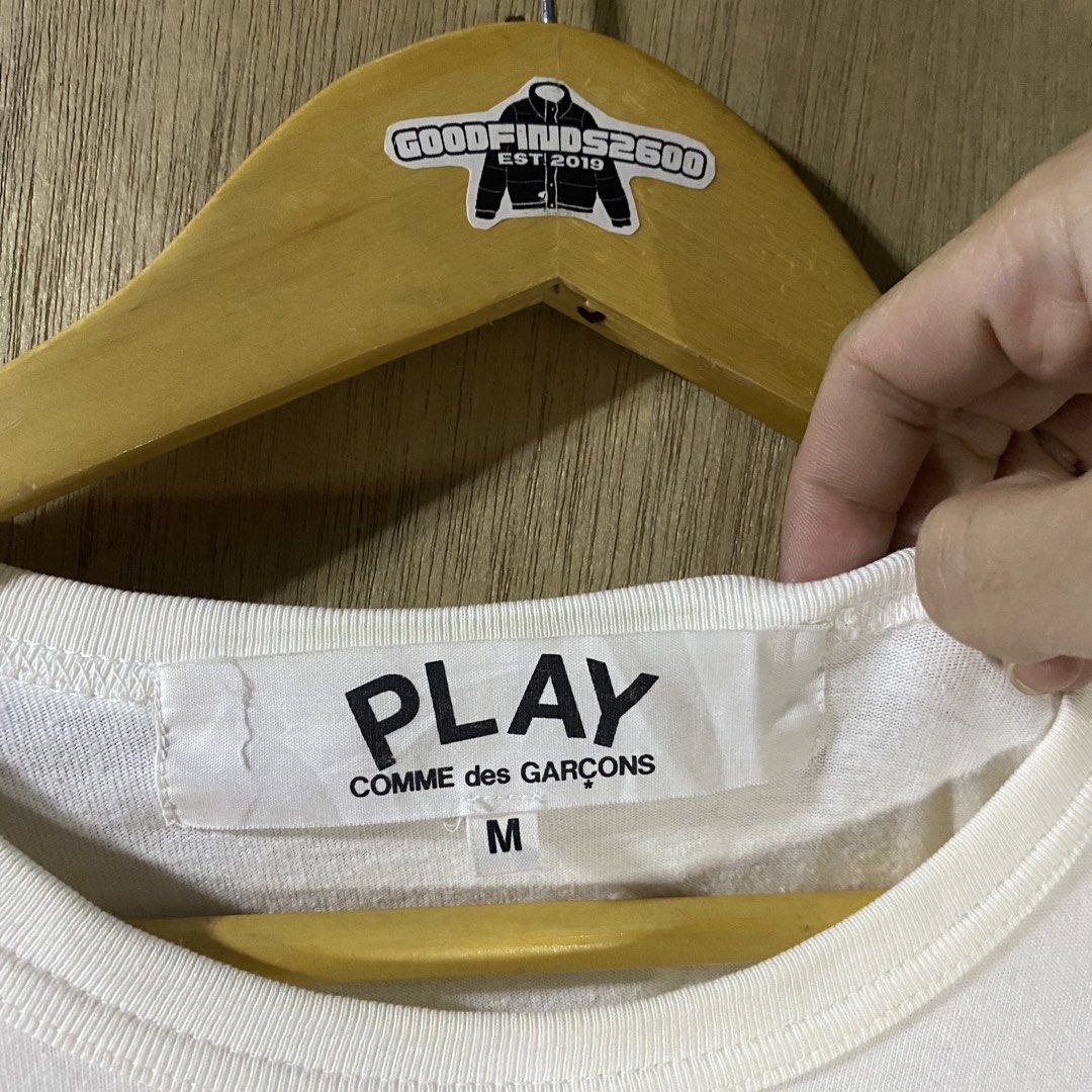 Play CDG Logo Shirt (Category: Tshirts & Polo Shirts ) located in Baguio. Submitted by goodfinds2600v2 (Listing ID 1461502026, Image 3). Description: Size on tag: M Dimensions: L-26 W/Bust-19.5 Description: unisex Condition: Good Issue/s: bleach stone on patch logo, yellow stains .